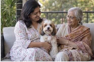 Two women seated beside a small dog on an outdoor patio